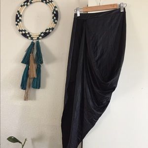 Faux leather wrapped skirt w/ mini side-slit.